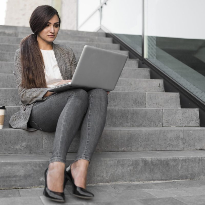 businesswoman-working-laptop-while-having-coffee-steps